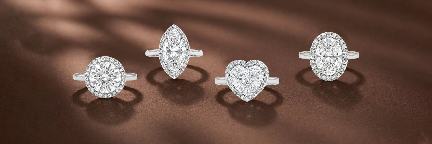 image showing halo ring featuring a colored lab-grown diamond heart, cushion, and oval shapes, Beautifully set for a sparkling finish 