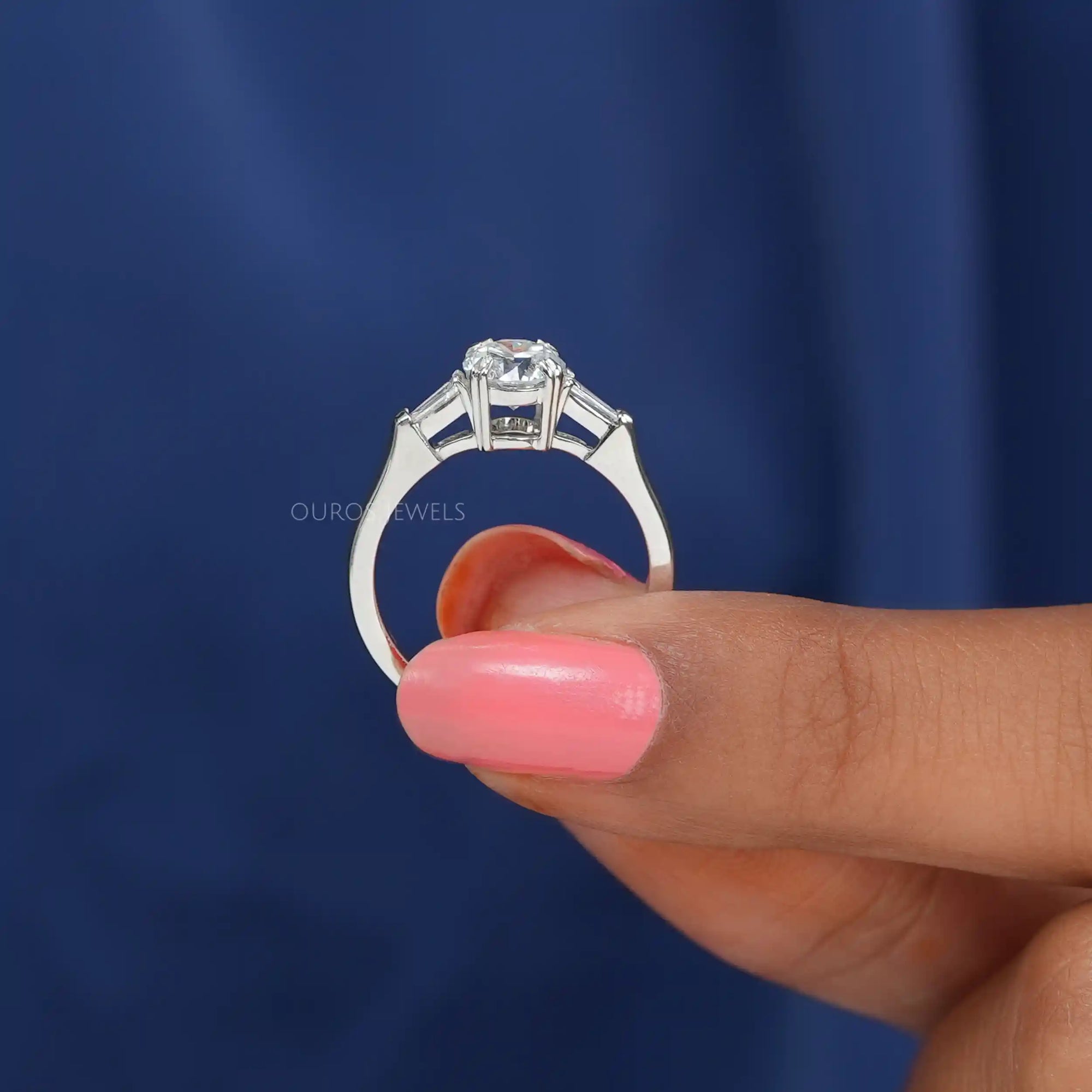 Round and Tapered Baguette Cut Three Stone Engagement Ring Ring