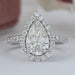 Pear Cut Halo Solitaire Accent Engagement Ring