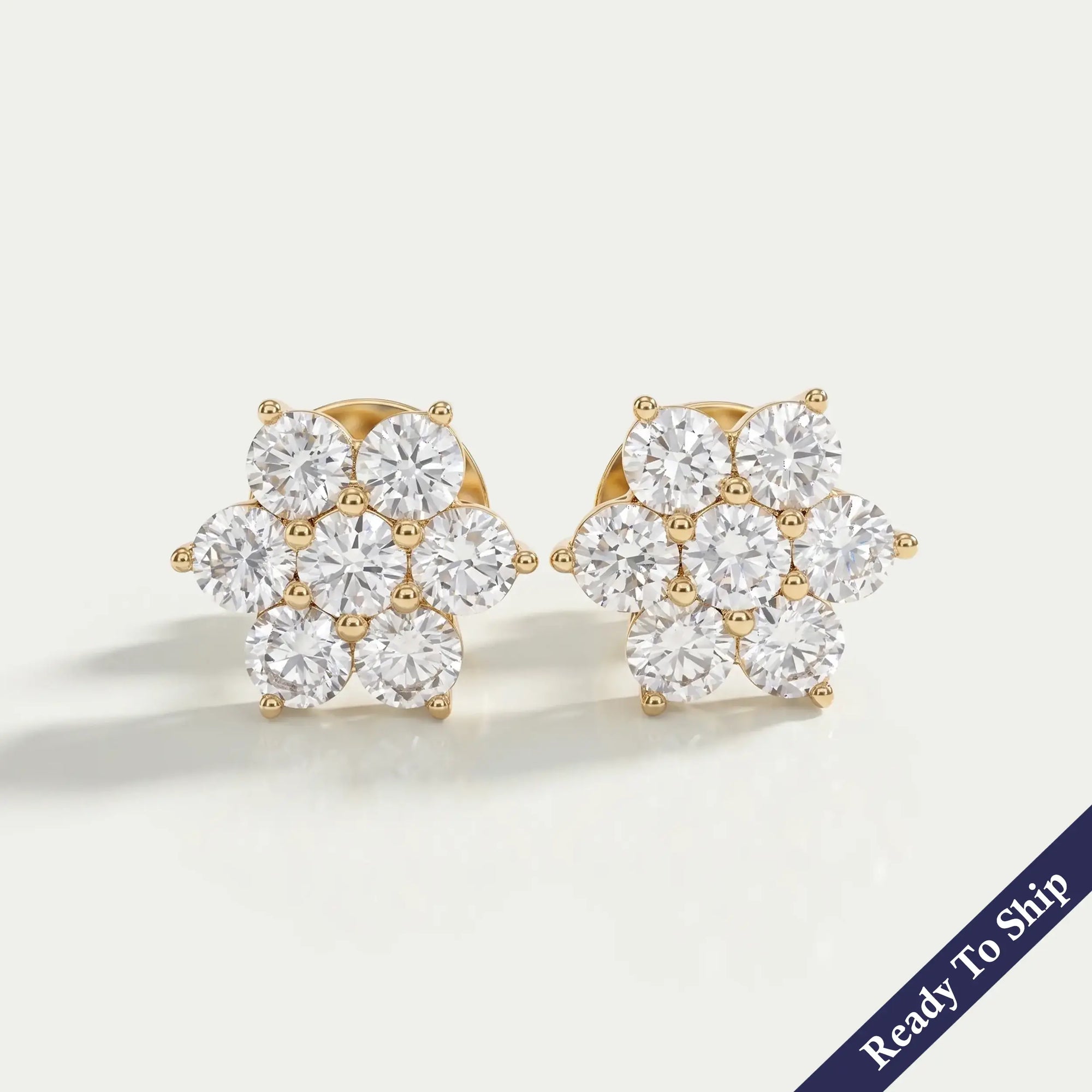 Blumenohrstecker mit rundem Diamant