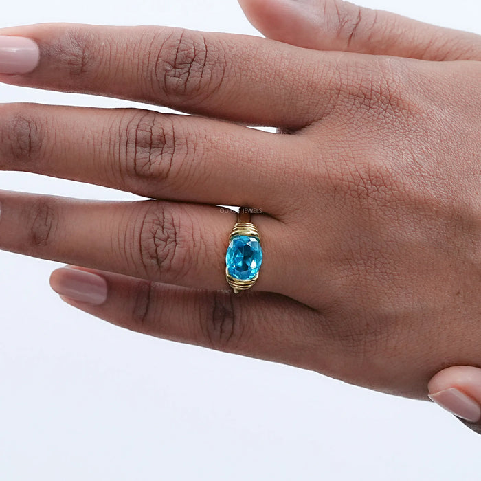 East-West Blue Oval Gemstone Solitaire Ring Rings