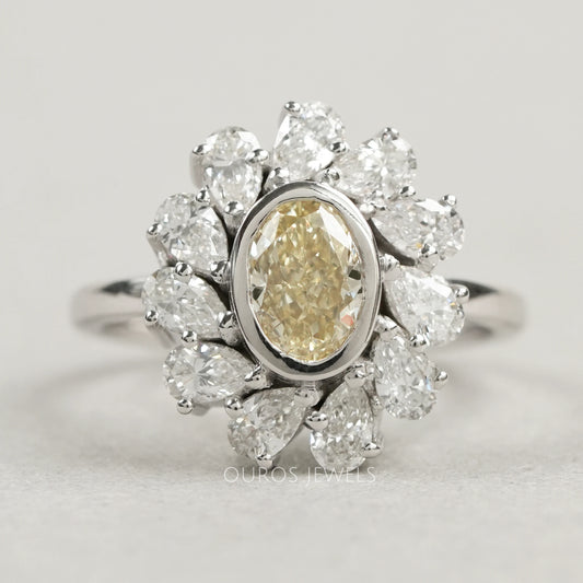 Yellow Oval Bezel Set Diamond With Pear Halo Ring