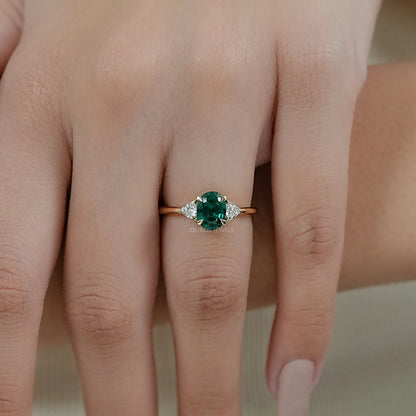 Trilogy Zambian Green Oval Gemstone And Trillion Cut Ring